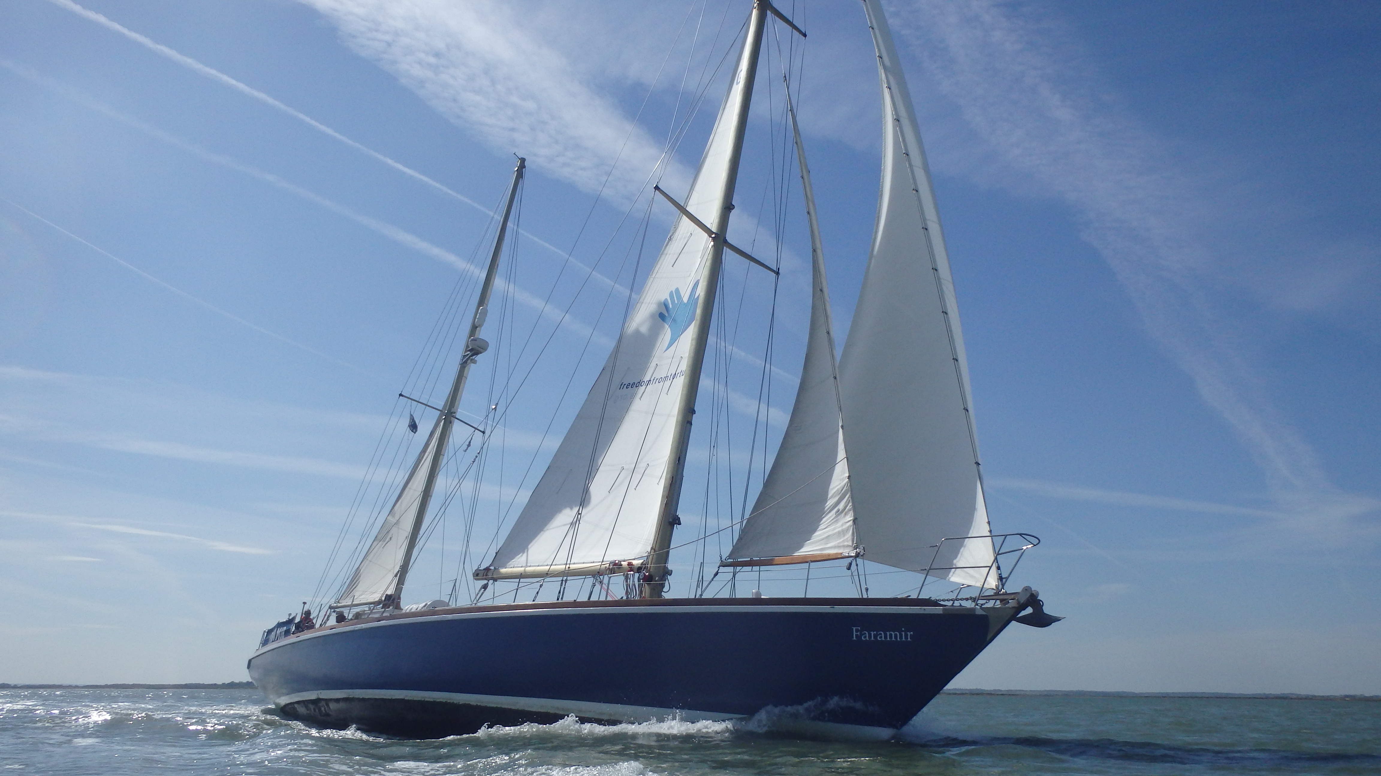 Starboard bow view of Faramir under sail on a sunny day