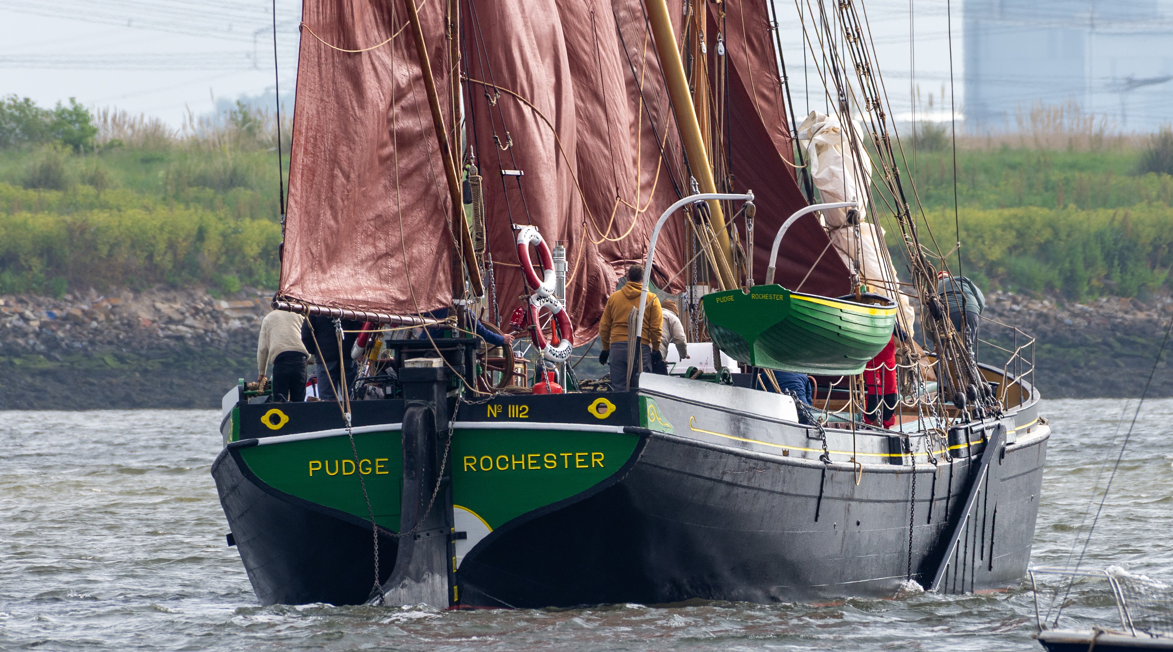 Stern view of Pudge under full sail