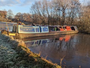 Bargus across the width of a canal