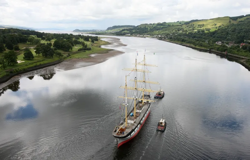 Bird's eye view of TS Glenlee being towed down the Clyde