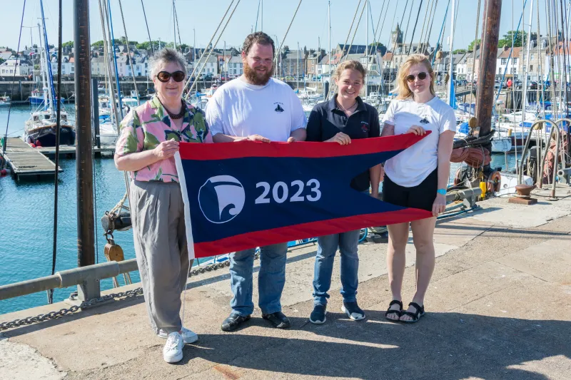 Swan being presented with the Flagship of the Year Award