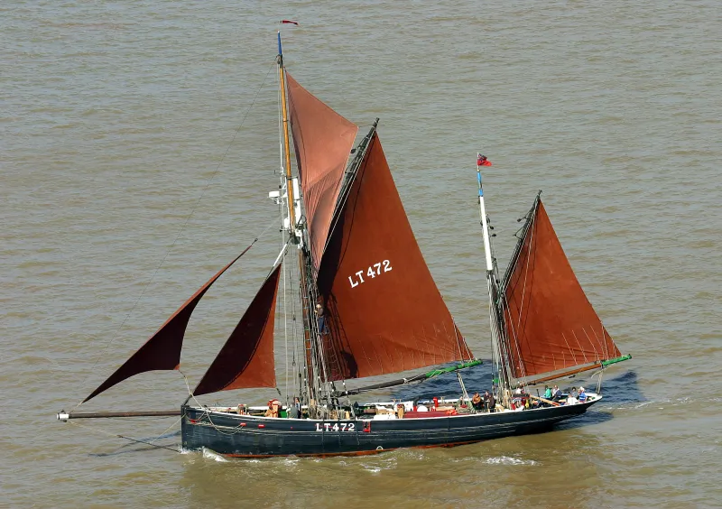 Excelsior under full sail, port side view