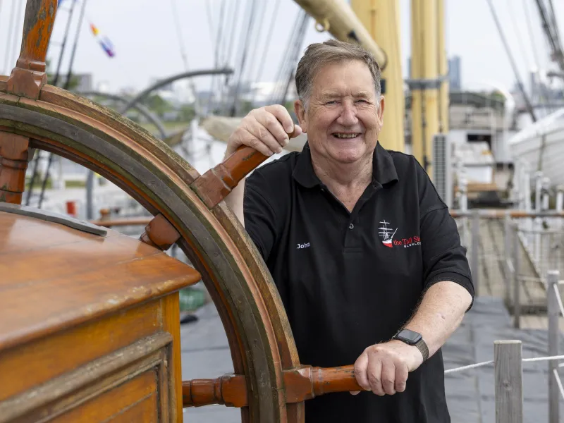 John Aitken at Glenlee's helm